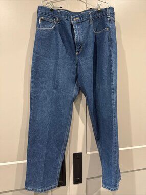 The Carhartt Straight Leg Jeans in a relaxed fit and dark wash denim are a versa